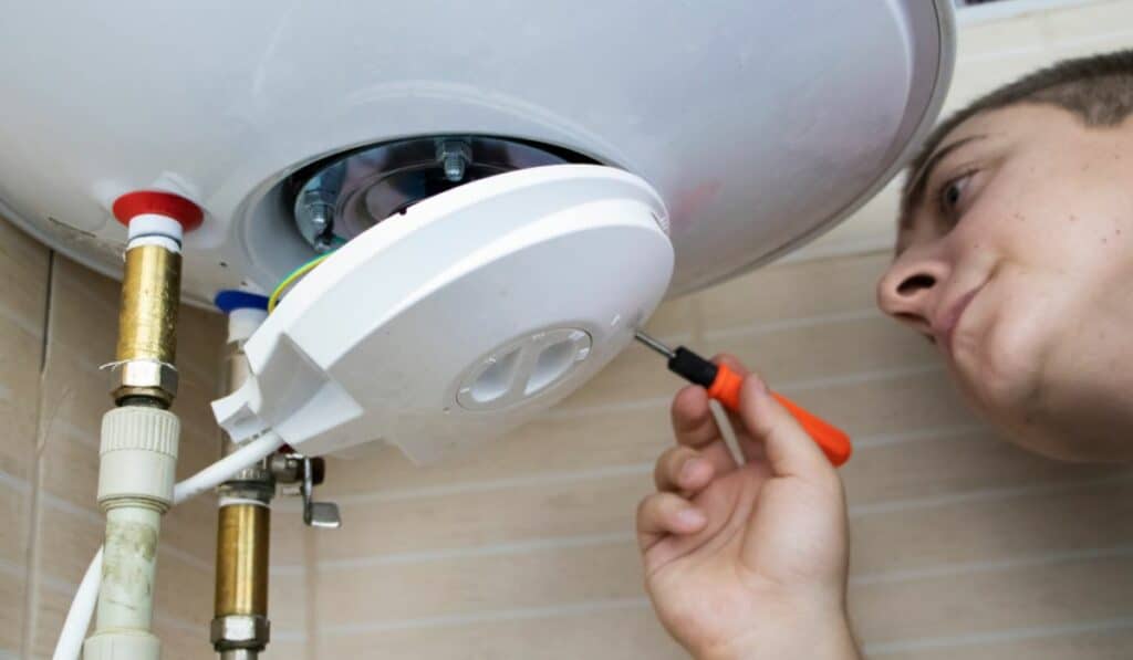 plumber fixing a geyser