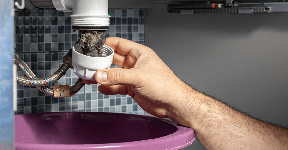 Blocked sink with buildup inside the pipe 
