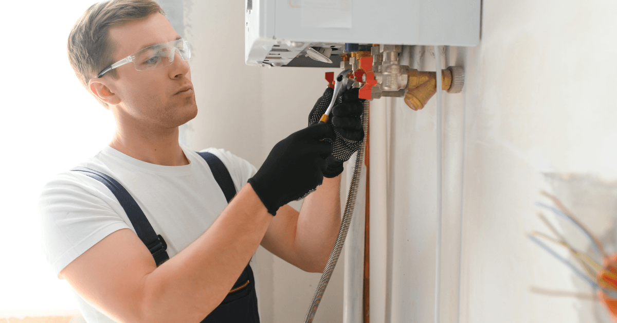 Registered technician repairing a gas geyser safely 