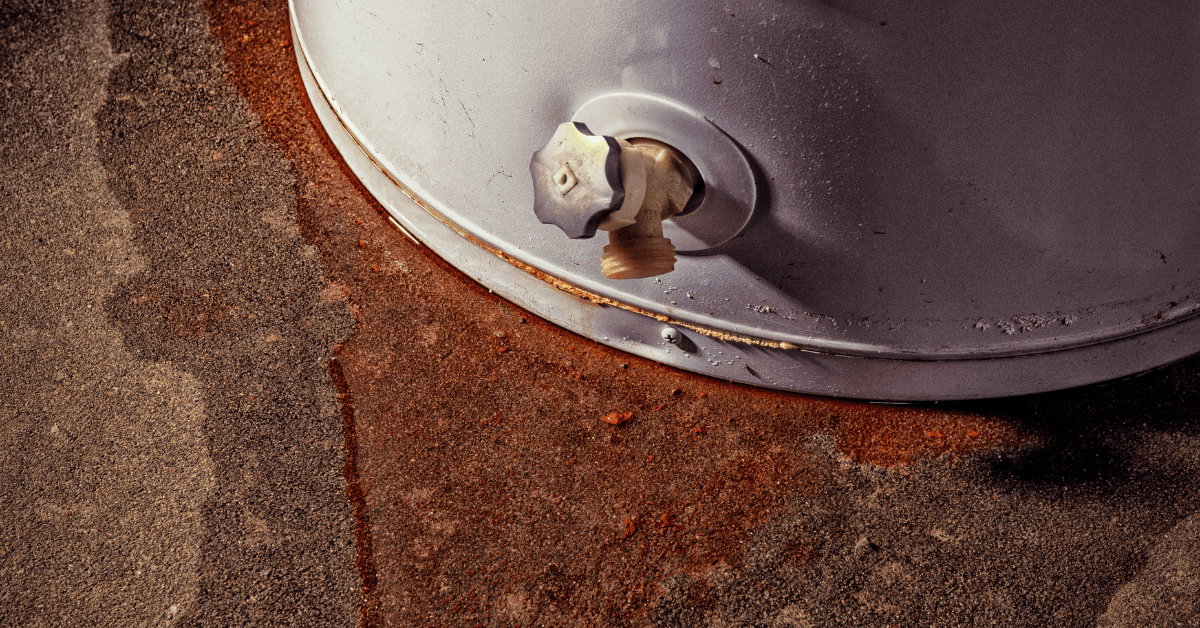Rust coloured water draining from a old gas geyser 