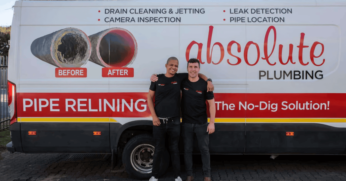Absolute plumbing team beside their branded service van 